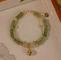 Women's natural Hetian jade bamboo bracelet on white background, adjustable 15+3 cm size