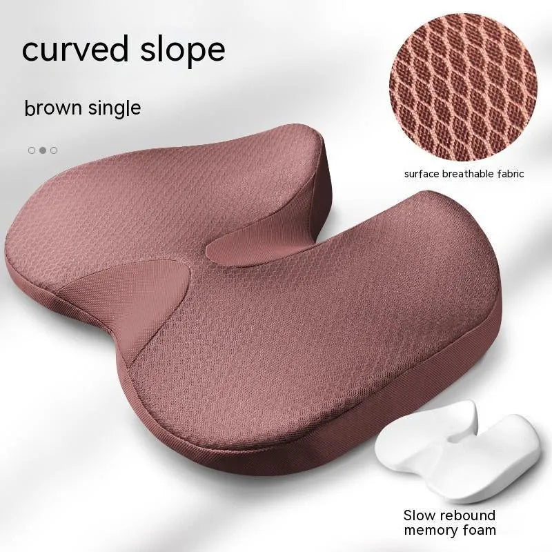 Curved bevel design seat cushion for tailbone support in beige colour on a chair