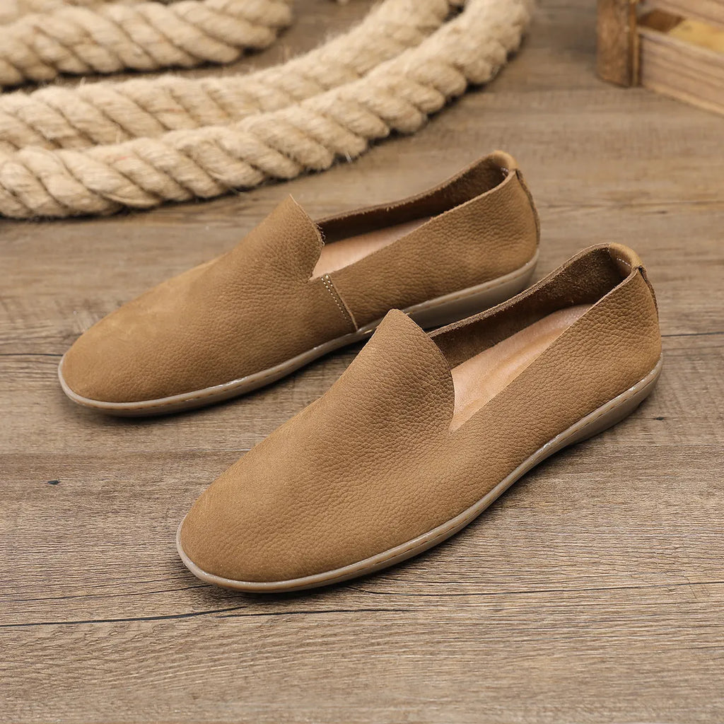 Handmade low top men's shoes in khaki or grey with a flat wedge heel and rubber sole.