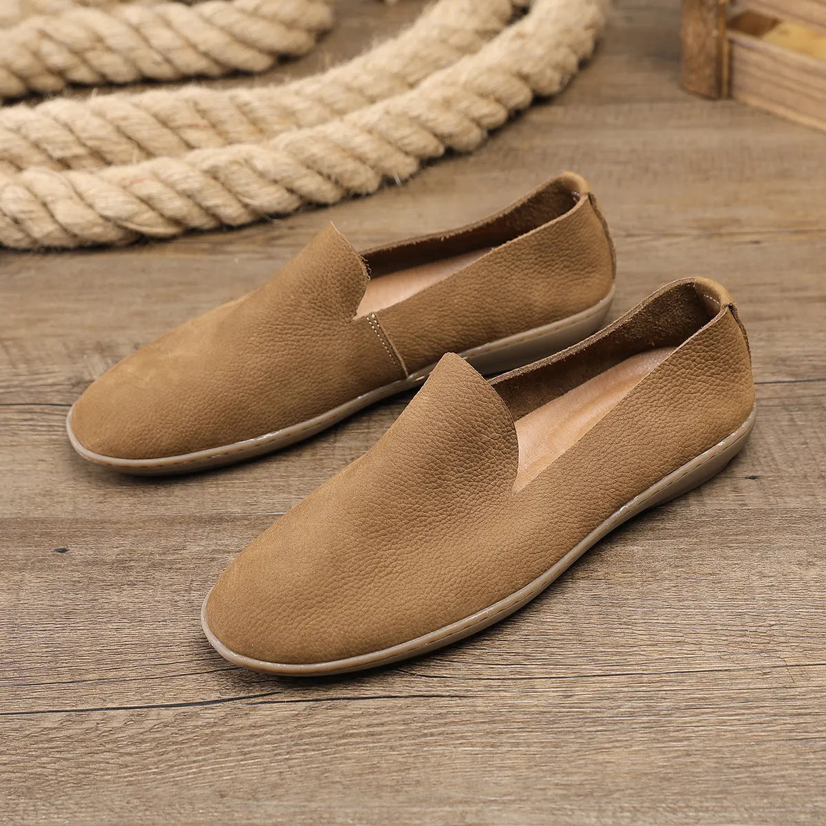 Handmade low top men's shoes in khaki or grey with a flat wedge heel and rubber sole.