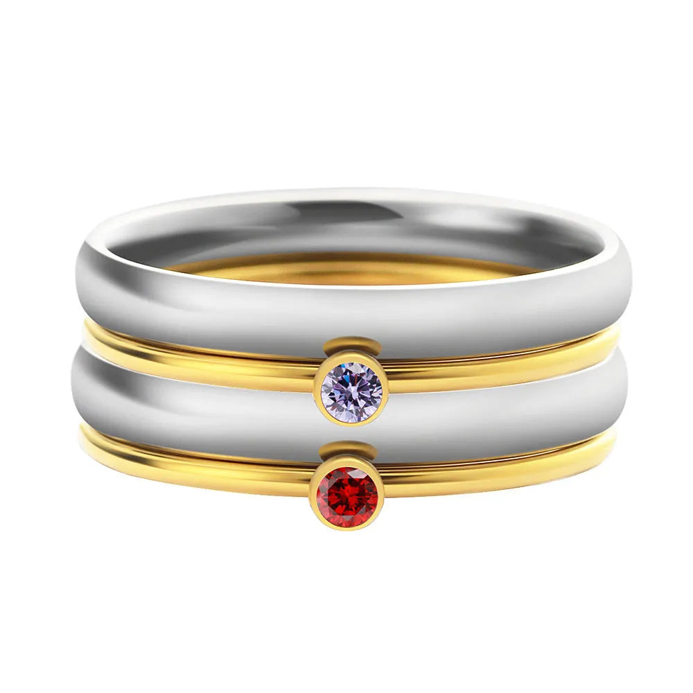 December colour birthstone engraved geometric ring in gold-tone titanium steel.