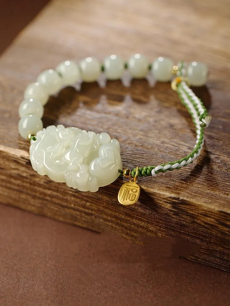 Hetian jade rabbit zodiac bracelet with S925 silver charm on red ice cotton rope