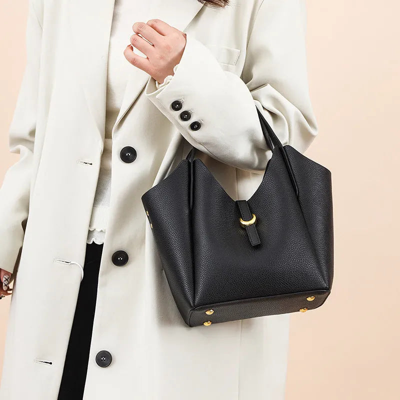 Genuine leather women's bucket bag with hand holding design in retro European American style