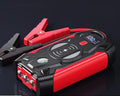Red car jump starter power pack with digital display and thick battery clips