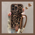 Brown leopard print silicone phone case with a detachable lanyard for an iPhone.