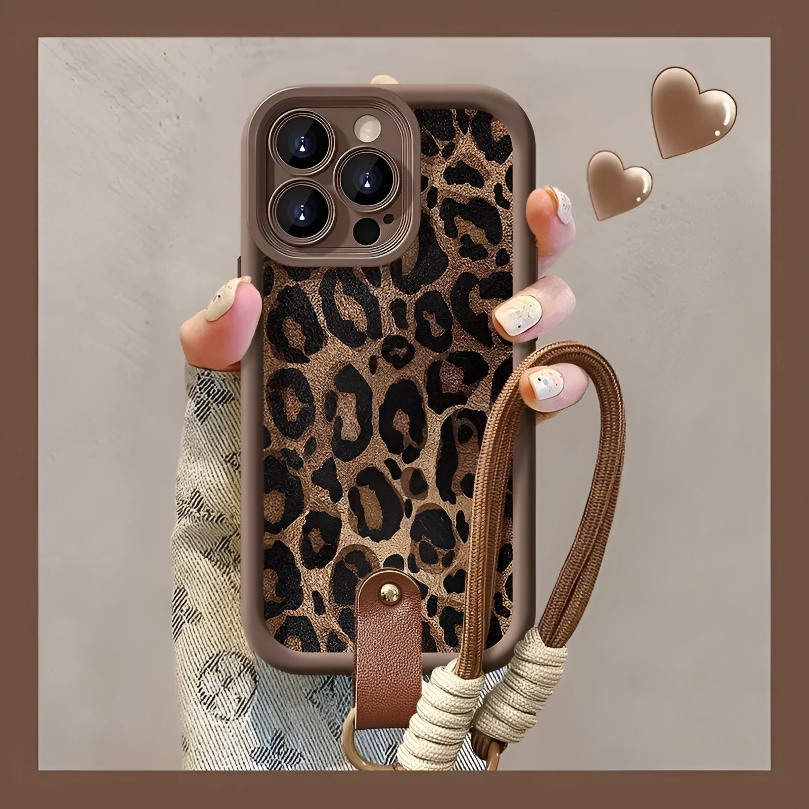 Brown leopard print silicone phone case with a detachable lanyard for an iPhone.
