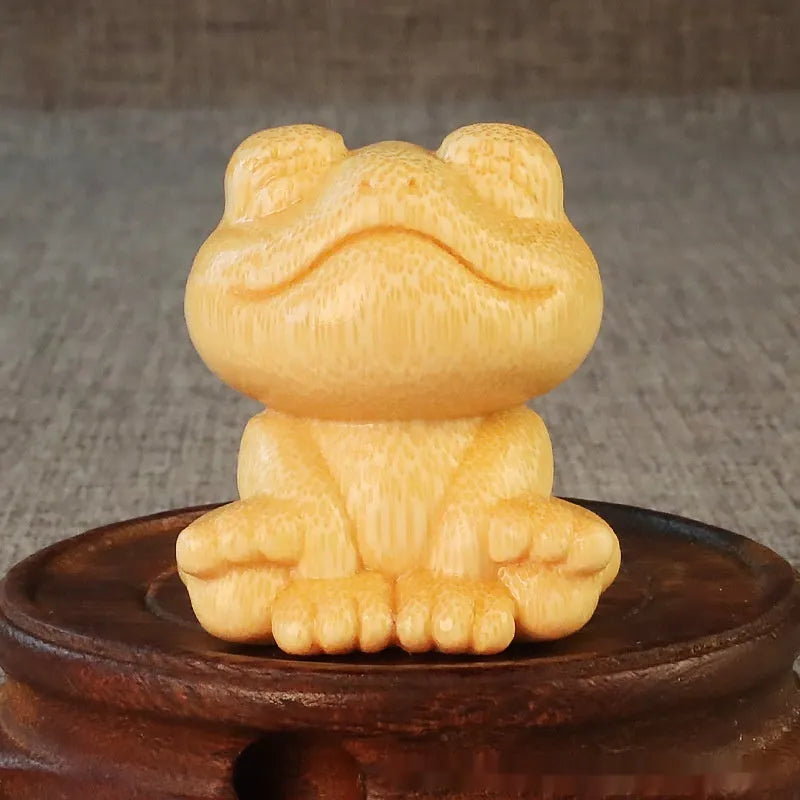 Smiling frog solid bamboo carving ornament with cartoon style measuring 5cm tall