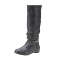 Women's black slip-on flat boots with round toe and high cylinder shaft on a non-slip rubber sole.