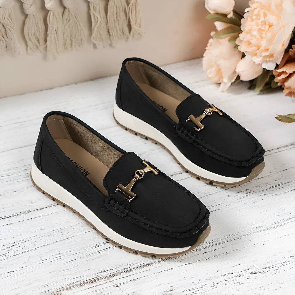 Women's non-slip PU leather loafers in beige with round toe and hollow-out side panels on a white background