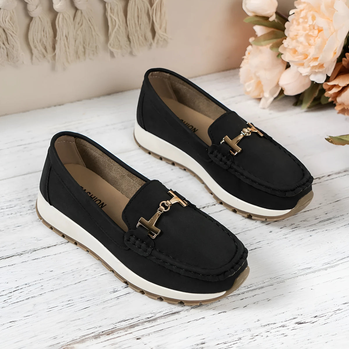 Women's non-slip PU leather loafers in beige with round toe and hollow-out side panels on a white background