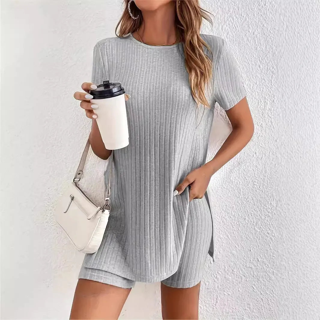 Women's black ribbed cotton shorts suit with crew neck top and matching shorts on a hanger.