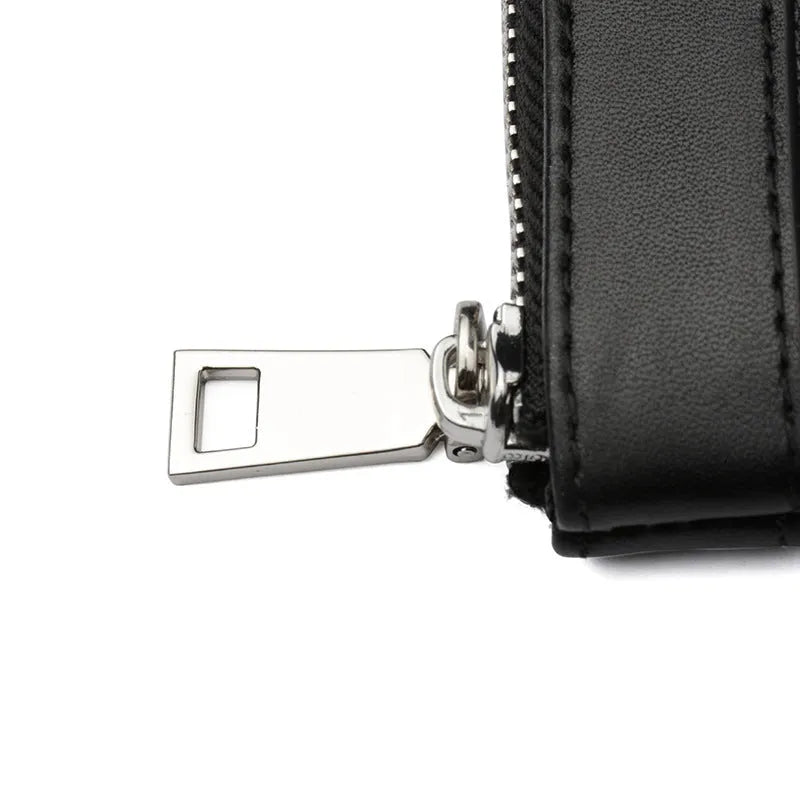 Black genuine cowhide leather men's clutch wallet showing its 20x10 cm size.