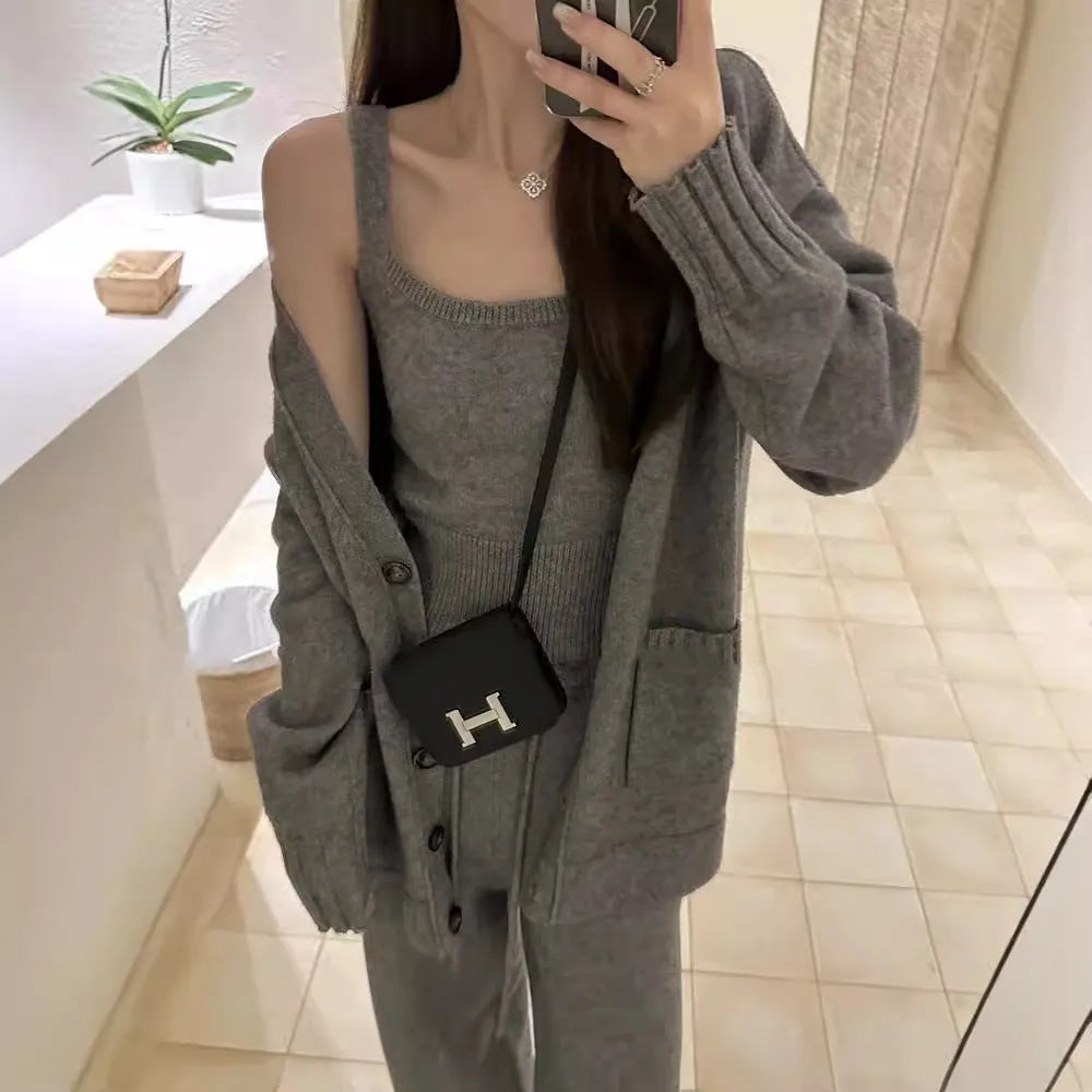 Women's light brown knit cardigan, vest, and casual pants three-piece set laid flat.