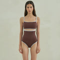 Brown women's triangle top one-piece swimsuit on hanger showing front design