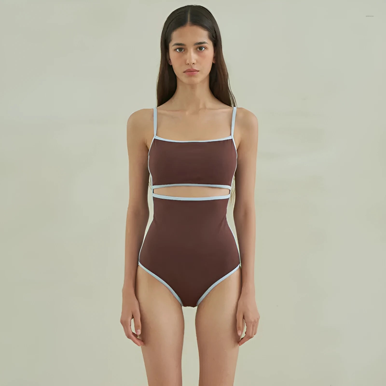 Brown women's triangle top one-piece swimsuit on hanger showing front design