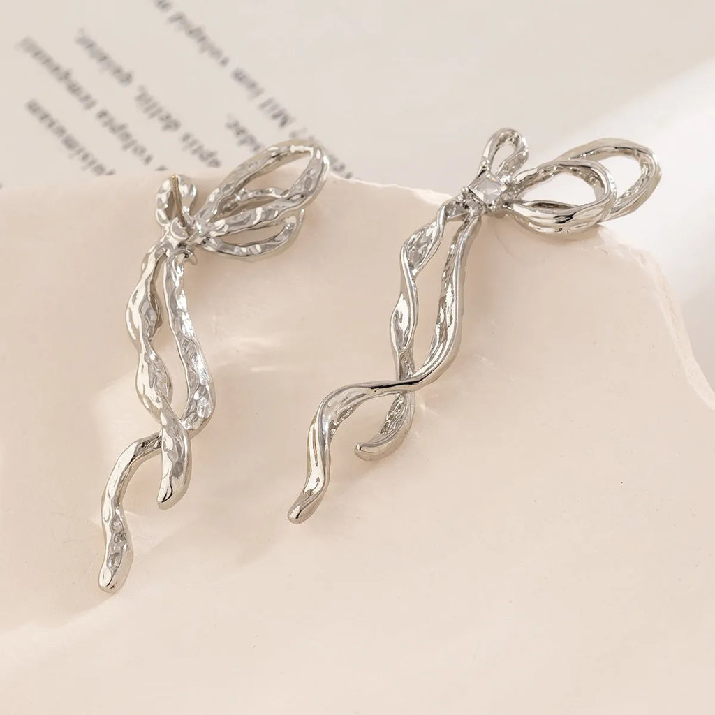 Alloy electroplated bowknot earrings in white K colour, women's fashion jewellery, bow shape stud earrings