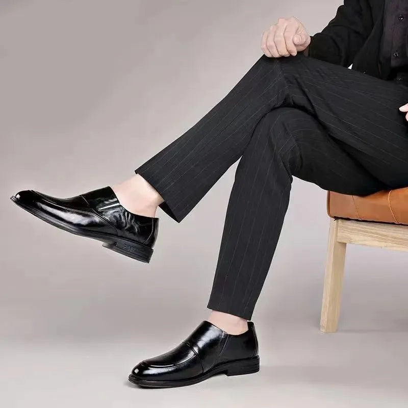 Business formal slip-on shoes with pointed toe, PU upper, rubber sole, and decorative metal and embossed details