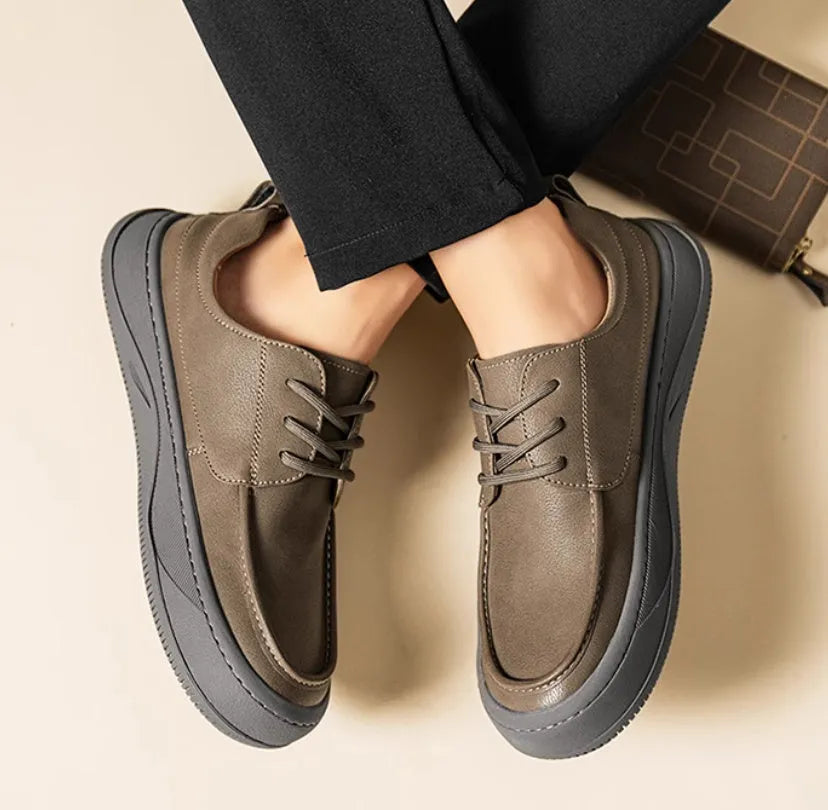 Men's brown retro-style leather casual shoes with a big toe design and visible stitching.