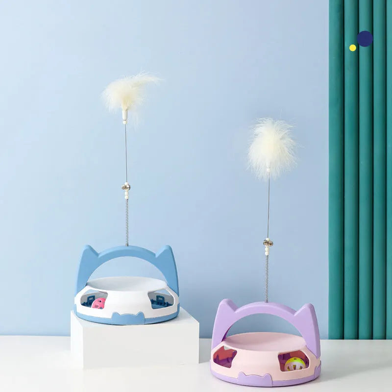 Blue and pink cat toy stick with spinning ball on a nylon wand, showing replaceable head.