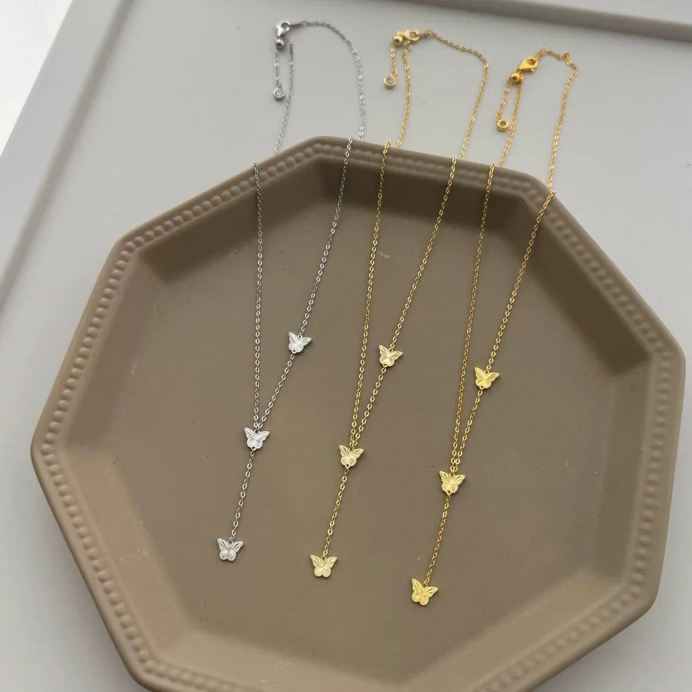 925 silver tassel butterfly pendant clavicle chain in electroplated 14K gold colour on display