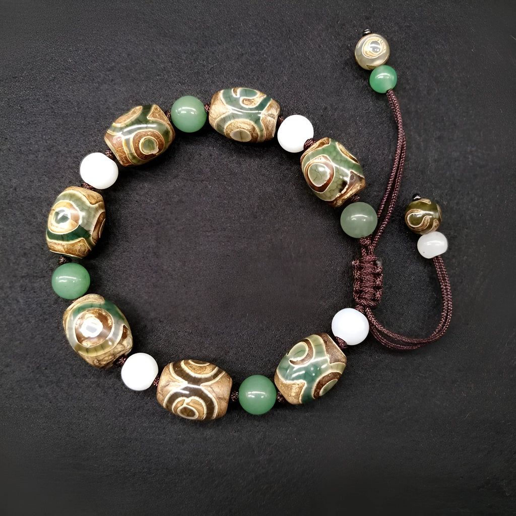 Green agate Tibetan bracelet with three-eye geometric bead pattern and adjustable cord closure