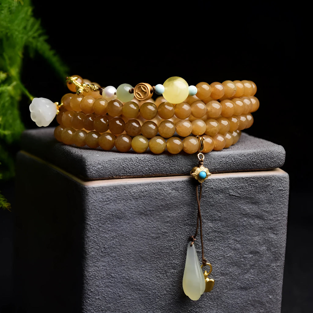 Women's green jade bead bracelet with leaf motifs and sequin details