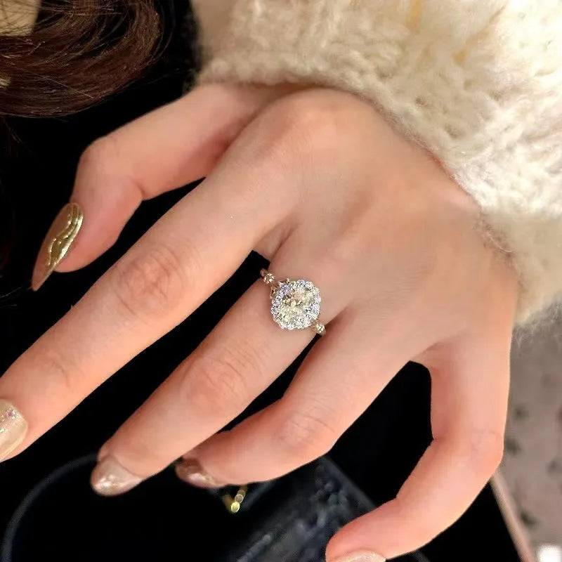 Silver geometric women's ring with ellipse detail and adjustable opening