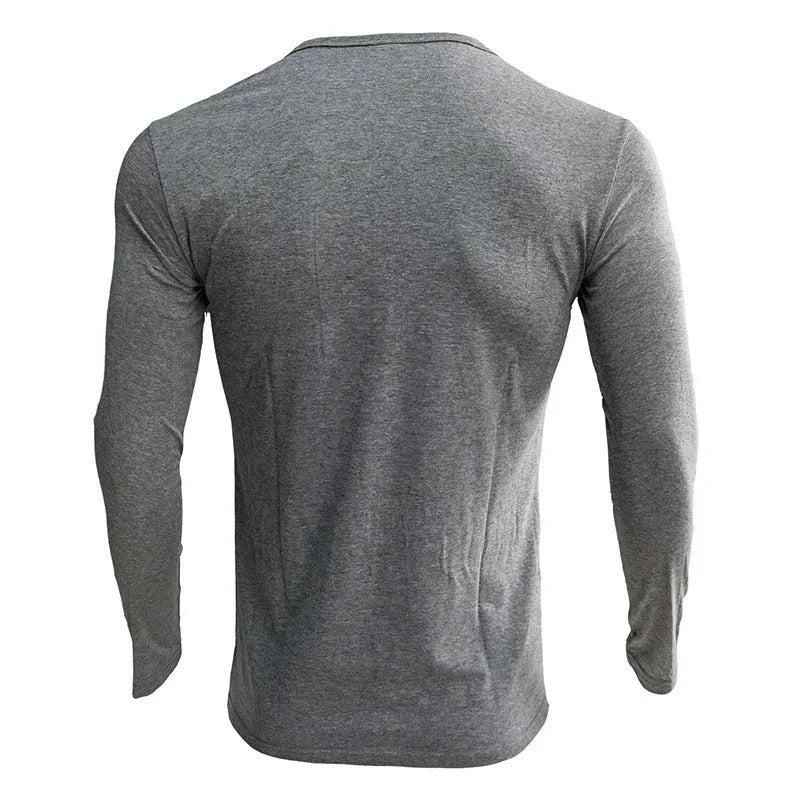 Men's solid colour long sleeve henley shirt in a cotton blend fabric on a neutral background.