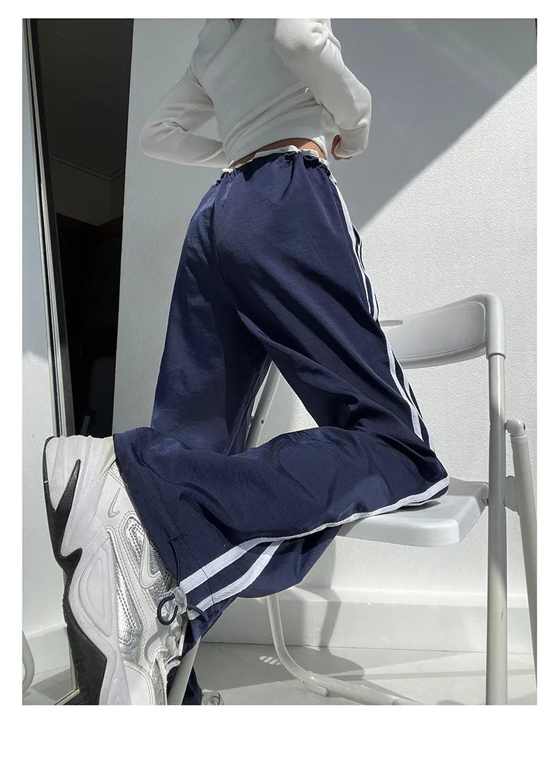 Women's navy blue loose straight pants with white contrast ribbon parallel bars detail and low waist