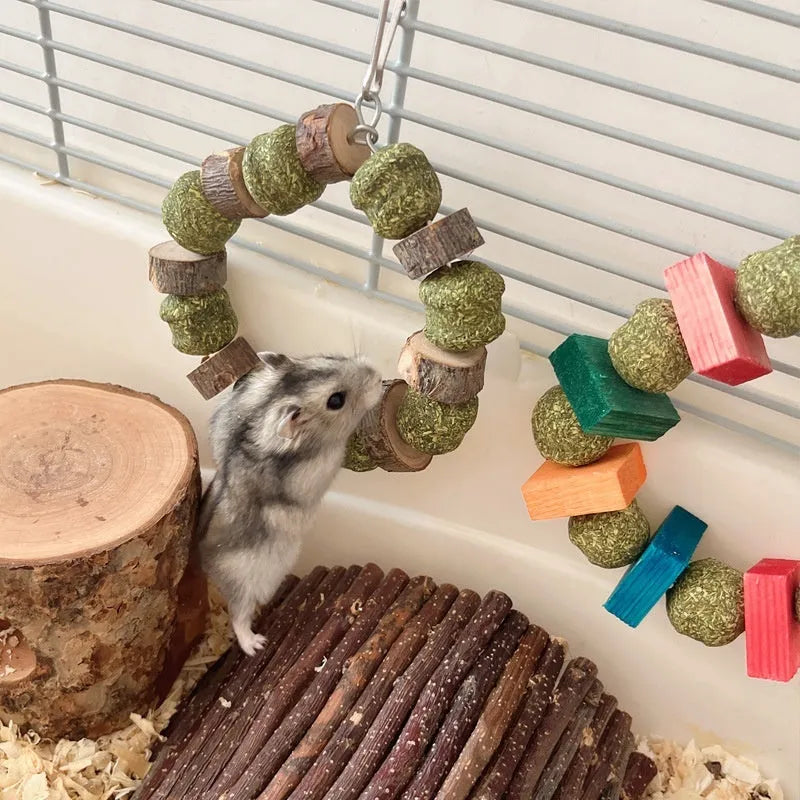 Hamster chew toy with decorative straw ball ring and applewood molar rods for small pets