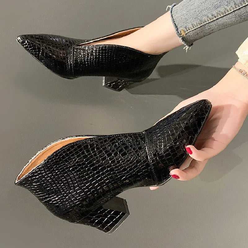 Women's black martin boots with pointed embossed toe and chunky heel