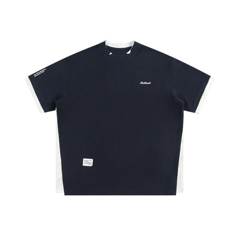 Retro loose waffle short-sleeved t-shirt with embroidered alphabet design in navy blue.