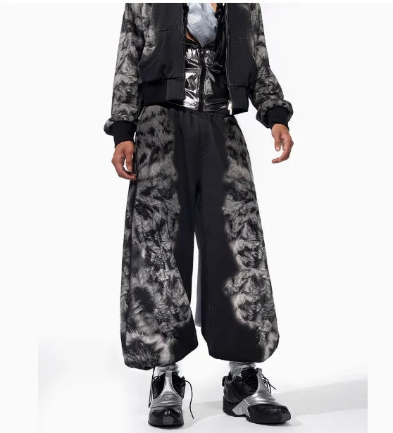 Loose-fit printed polyester streetwear co-ord set showing trousers, seven-inch shorts, and a hoodie on a hanger.