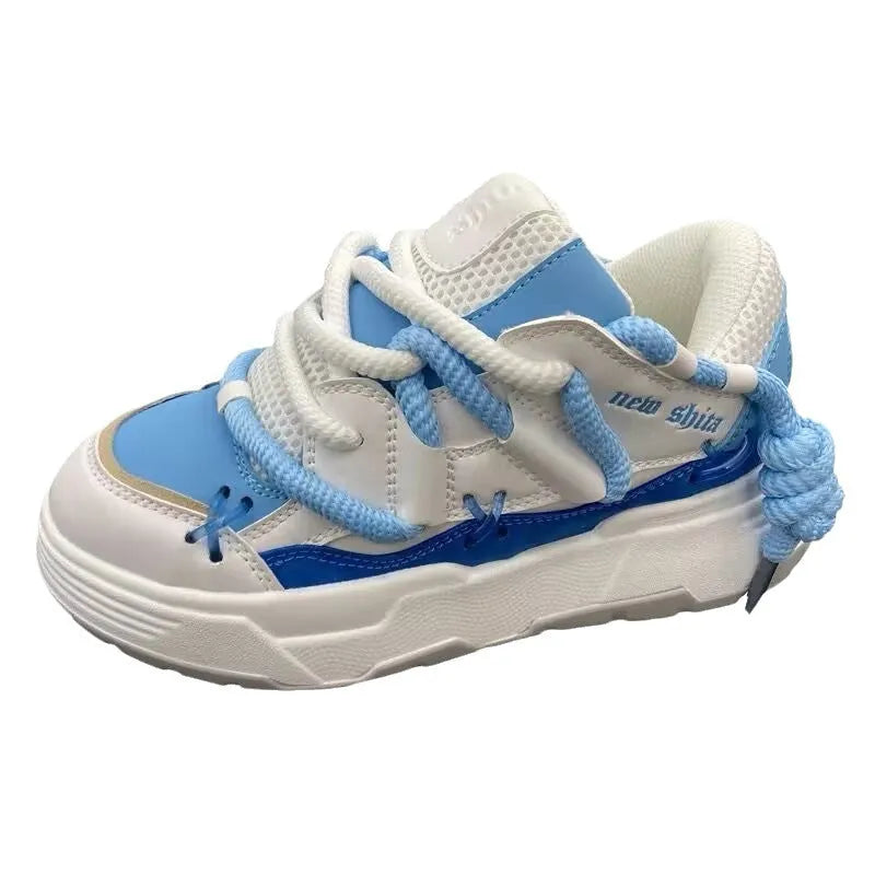 Women's grey retro chunky sneakers with thick rubber platform sole and front lace-up closure