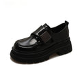 Women's black chunky heel British style shoes with square heel, cross strap, and round toe
