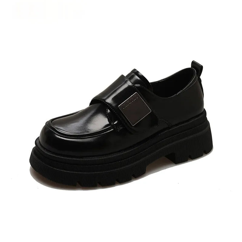 Women's black chunky heel British style shoes with square heel, cross strap, and round toe