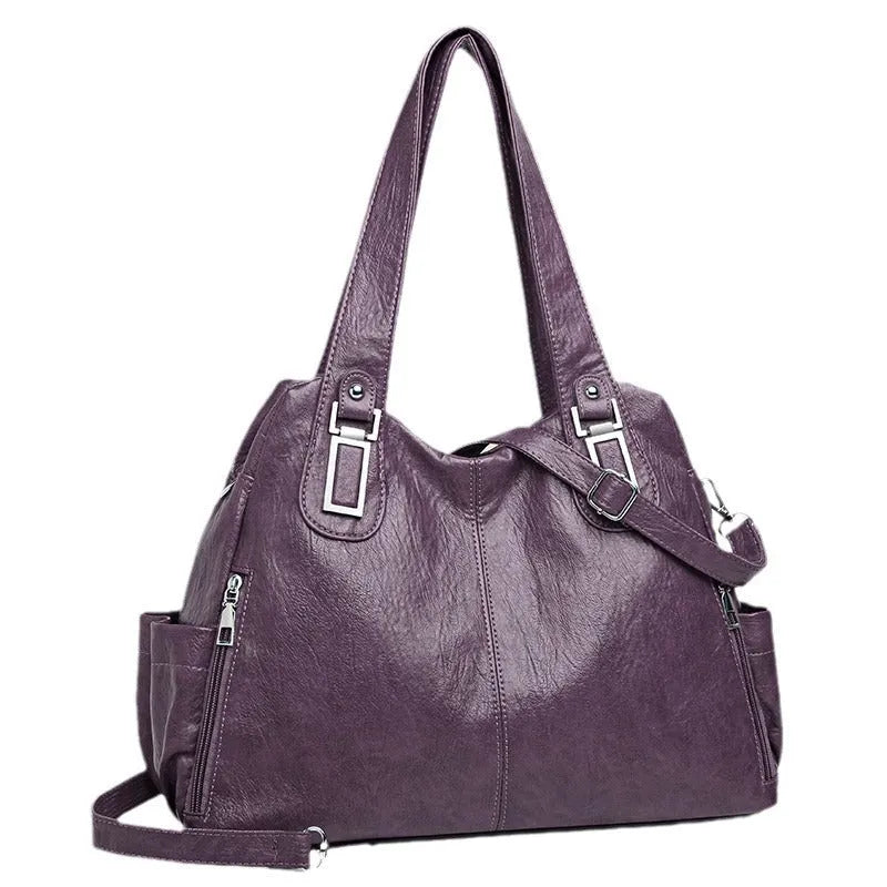 Soft PU women's tote bag in square vertical model with single shoulder strap showing internal organisational pockets