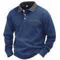 Man wearing a dark grey long-sleeved waffle-texture polo shirt with an asymmetric design detail.