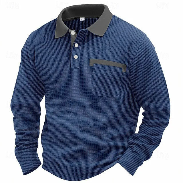 Man wearing a dark grey long-sleeved waffle-texture polo shirt with an asymmetric design detail.