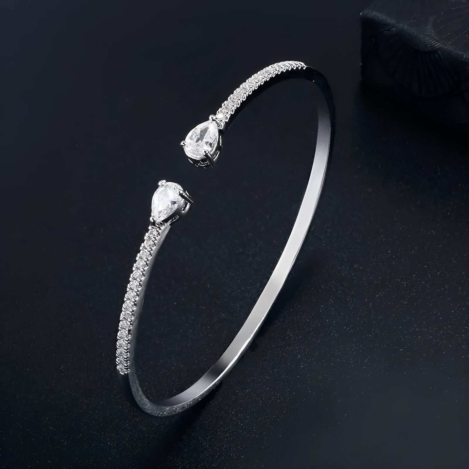 Copper multi-zircon bracelet with simple style in white colour option showing inlaid zircon treatment