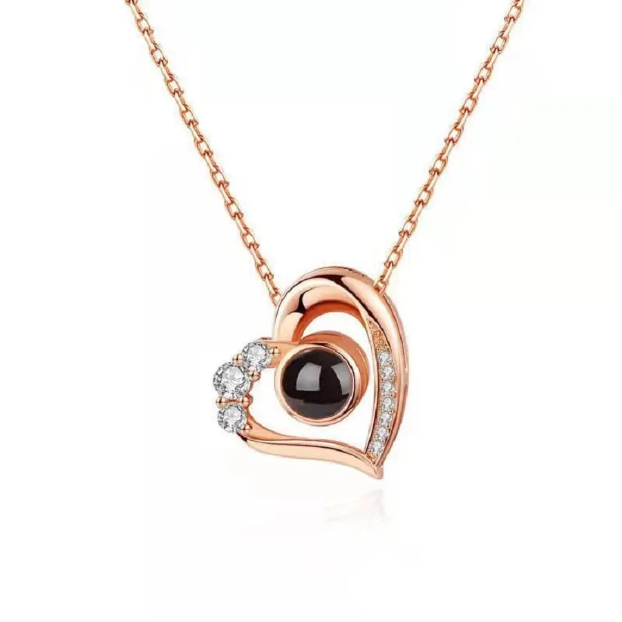 Geometric copper projection necklace with diamond inlay, rose gold finish, cross chain style on collarbone