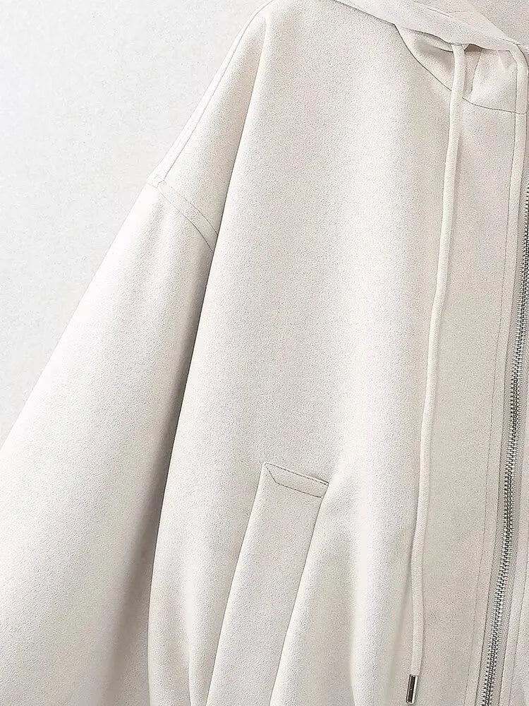 Women's suede hooded jacket in white and black colours showing casual styling