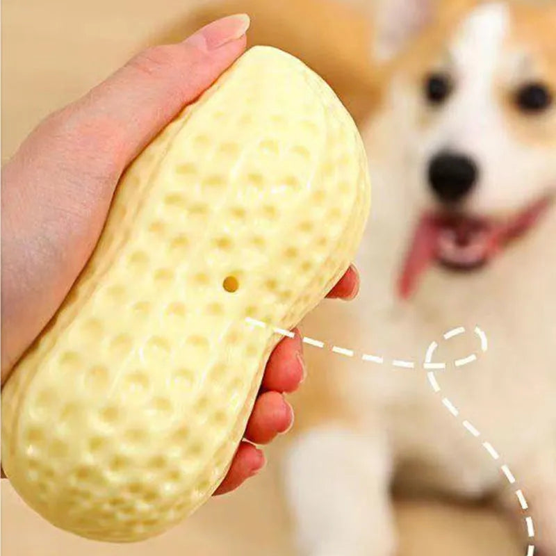 Yellow peanut-shaped dog chew toy with textured shell for teeth cleaning