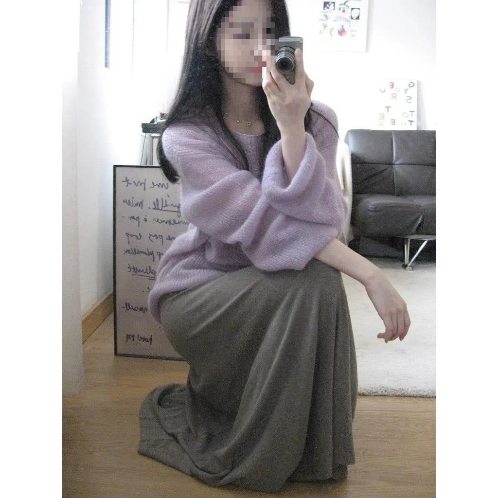 Purple sleeveless women's blouse with princess sleeves and a shoulder strap detail.