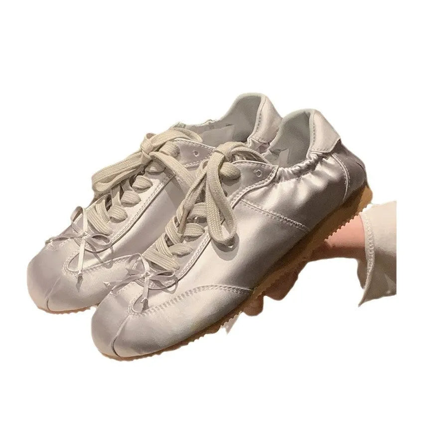 Women's satin ballet flats with round toe and lace-up closure in silver grey, pearl white and champagne pink colours