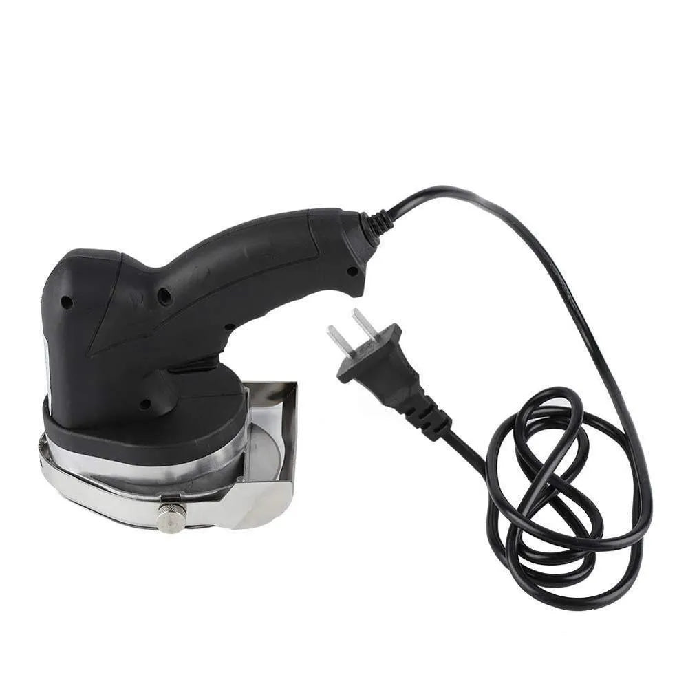 Black electric meat cleaver with 80W motor and EU plug on a work surface.