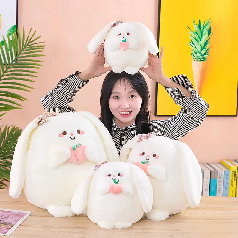 Rabbit peach plush toy in 20cm, 25cm, 35cm and 45cm heights on a plain background