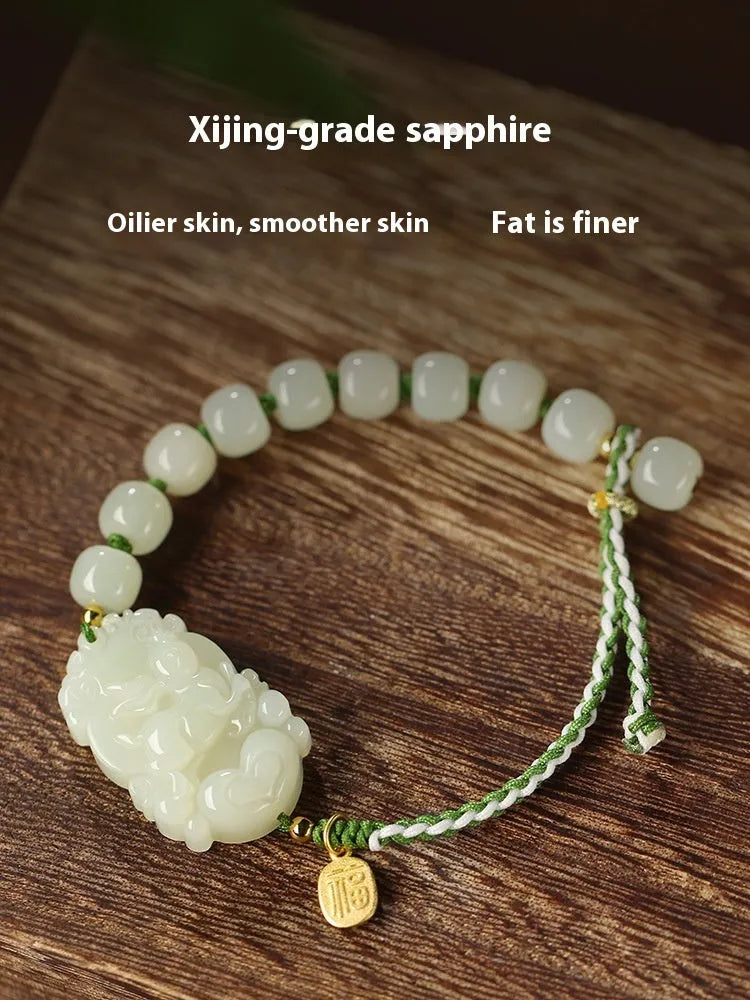 Hetian jade rabbit zodiac bracelet with S925 silver charm on red ice cotton rope