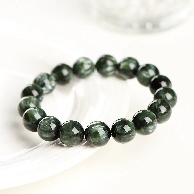 Green Dragon Crystal bracelet with 8-9mm geometric round beads and Ruyi design.