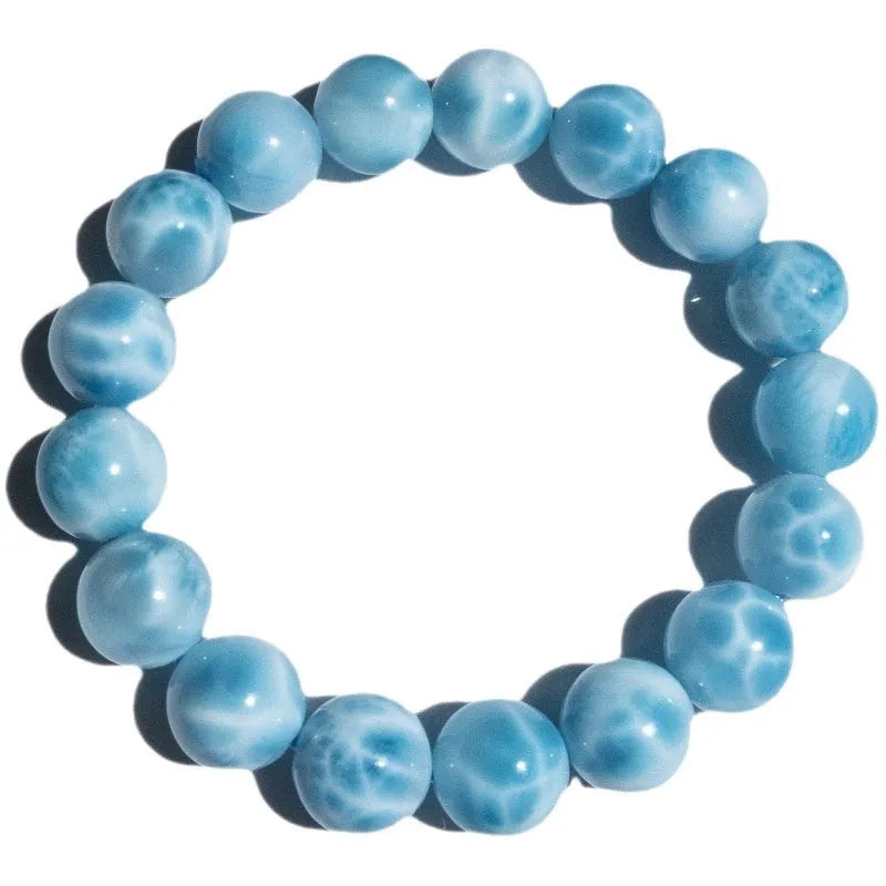 Blue handmade Bodhi bracelet with natural crystal stones and pearl accents in Maillard style.